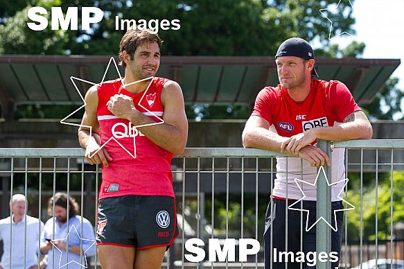 Josh Kennedy from the Sydney Swans and Sam Groth of Australia training with the Sydney Swans