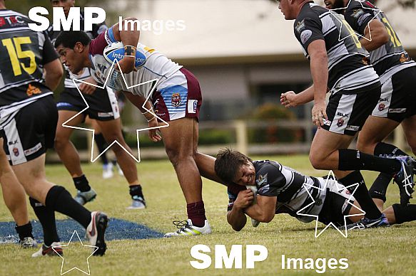 SAMUEL IRWIN of the Seagulls hangs on to JOHN ASIATA of the Cutters