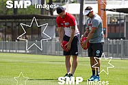 Nick Davis of the Sydney Swans and Sam Groth of Australia training with the Sydney Swans